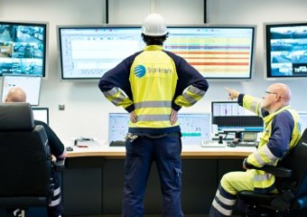 Three Workers at Central Control Room in Knapsack