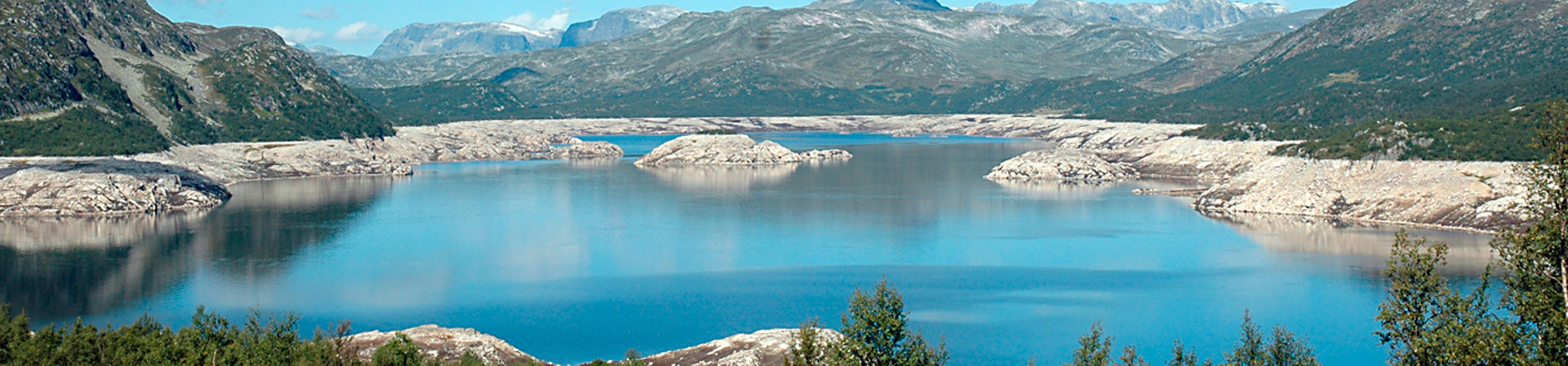 Lake with mountains around it